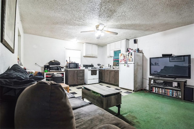 living room featuring light carpet, ceiling fan, and a textured ceiling