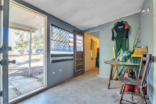 entryway with concrete flooring and a textured ceiling