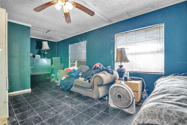 bedroom with attic access, ornamental molding, ceiling fan, and a textured ceiling