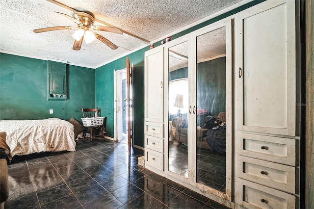 bedroom with a ceiling fan, crown molding, and a textured ceiling