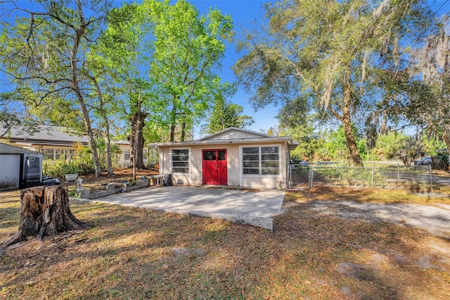 view of outbuilding with an outdoor structure and fence