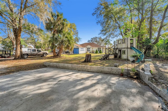 view of yard with a playground