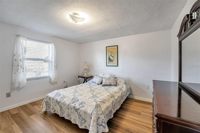 651 W Lake Brantley Rd, Altamonte Springs, FL 32714 - bedroom featuring light wood finished floors, baseboards, and a textured ceiling