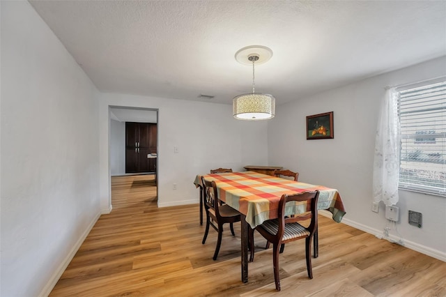651 W Lake Brantley Rd, Altamonte Springs, FL 32714 - dining area featuring light wood-style floors and baseboards