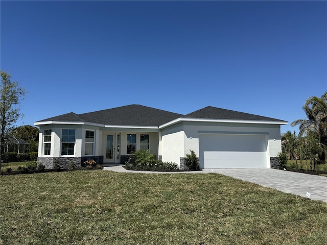 view of front of house with stucco siding, french doors, a garage, stone siding, and decorative driveway