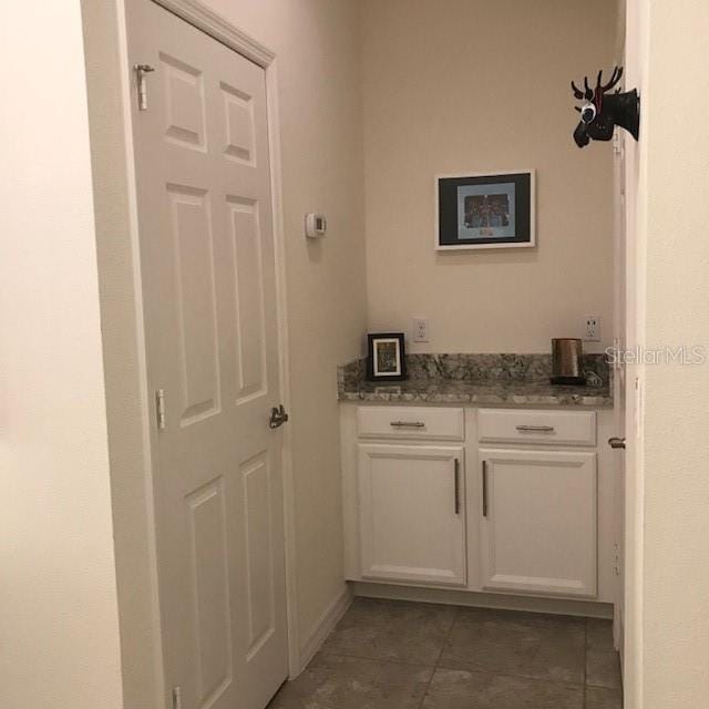 bathroom with tile patterned floors