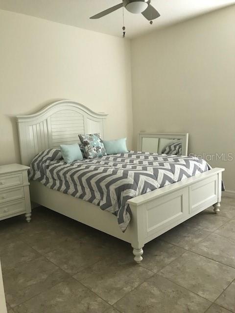 bedroom featuring ceiling fan