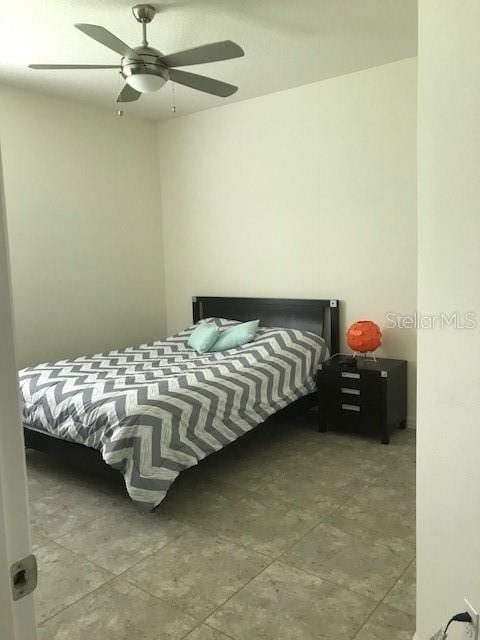 bedroom featuring ceiling fan