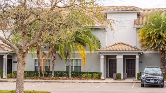 view of property with uncovered parking