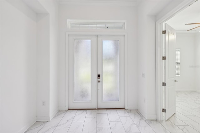 doorway featuring marble finish floor, a wealth of natural light, and french doors