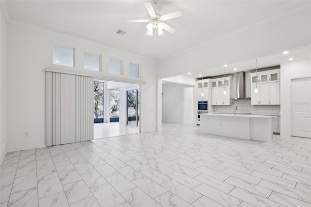 unfurnished living room featuring visible vents, ceiling fan, marble finish floor, a sink, and recessed lighting