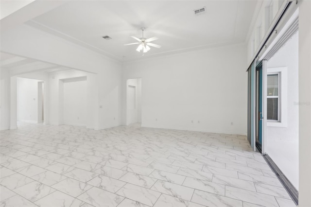 unfurnished room with marble finish floor, ceiling fan, and visible vents