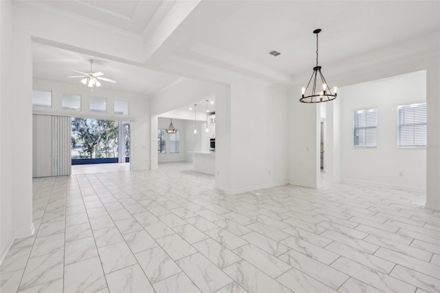 spare room with marble finish floor, visible vents, ornamental molding, baseboards, and ceiling fan with notable chandelier