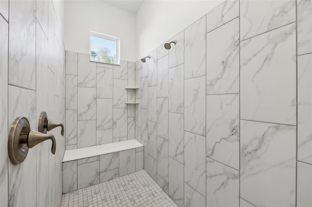 full bathroom featuring tiled shower