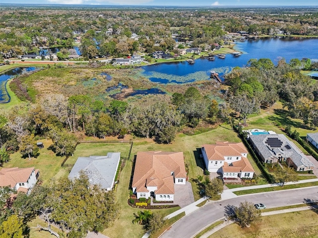 bird's eye view featuring a water view and a residential view