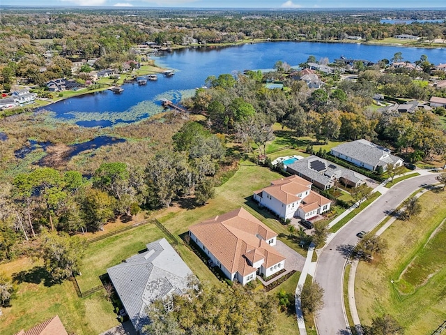 birds eye view of property featuring a water view and a residential view