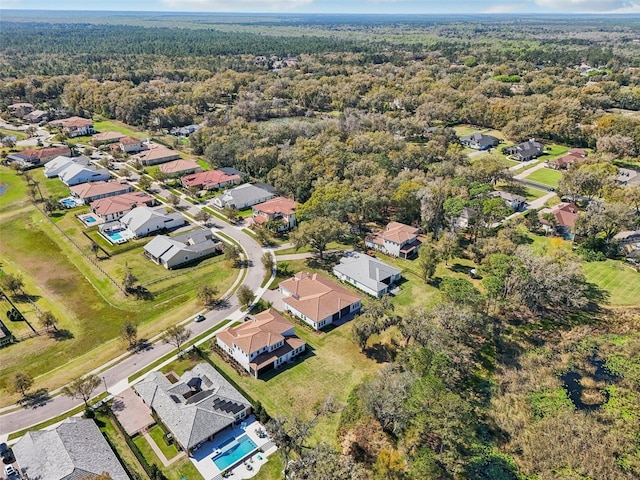 aerial view with a residential view and a view of trees