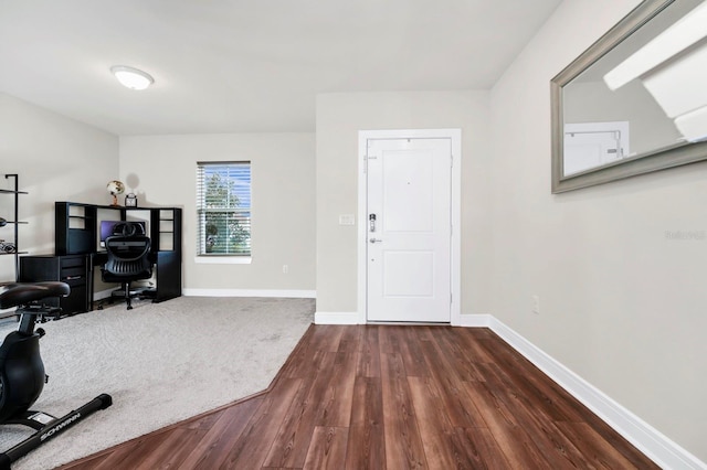 office space with dark wood-style floors and baseboards