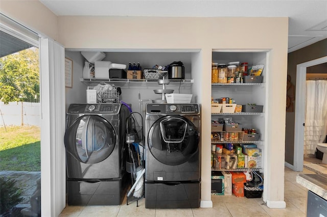 laundry area with tile patterned flooring, laundry area, and separate washer and dryer