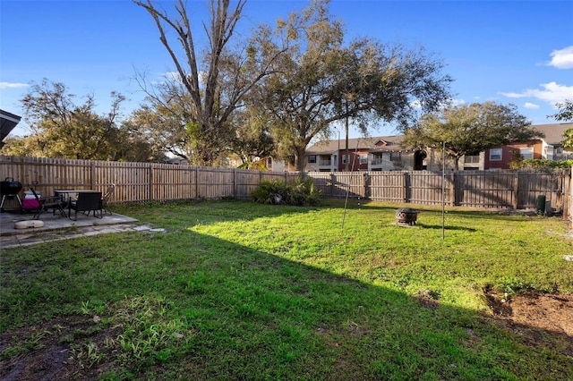 view of yard with a patio area and a fenced backyard