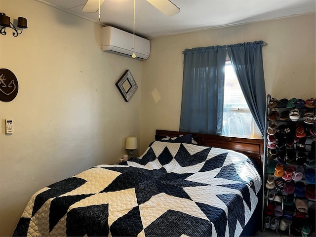 bedroom with a wall mounted AC and a ceiling fan