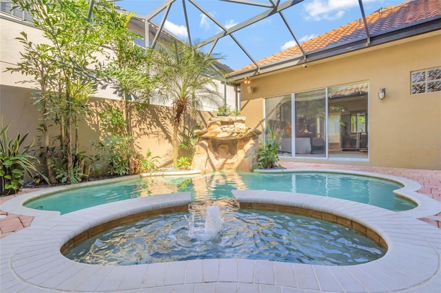 view of pool featuring a pool with connected hot tub