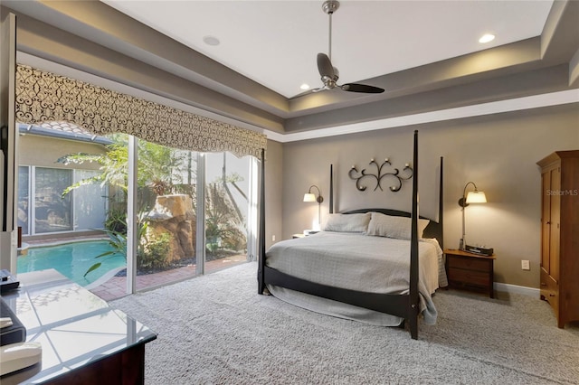 carpeted bedroom featuring recessed lighting, a raised ceiling, a ceiling fan, and baseboards