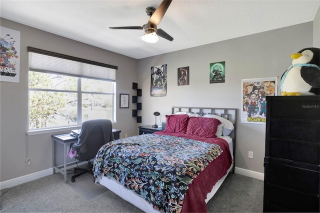 bedroom featuring carpet flooring, a ceiling fan, and baseboards