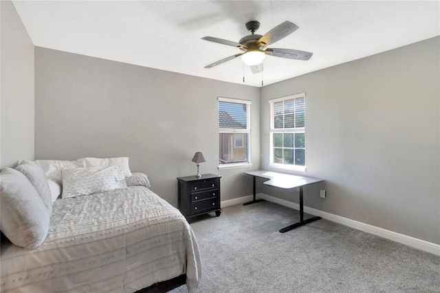 bedroom with carpet flooring, a ceiling fan, and baseboards