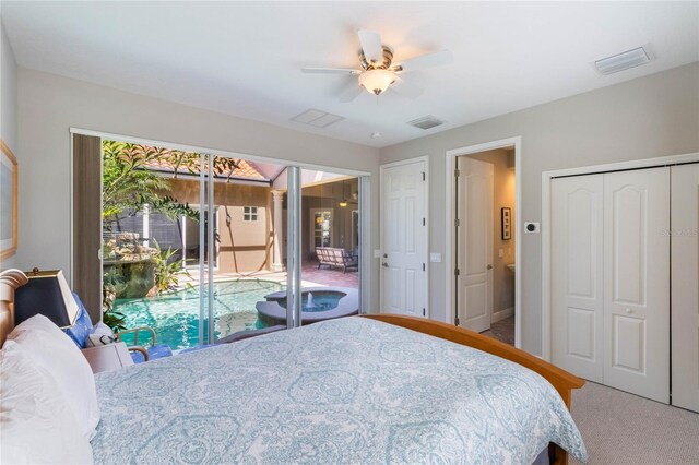 bedroom with carpet, visible vents, and a ceiling fan