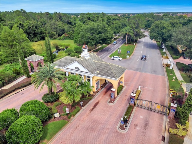 birds eye view of property featuring a view of trees