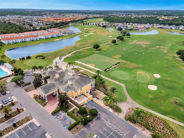 drone / aerial view featuring a water view and golf course view