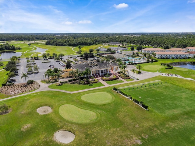 aerial view featuring golf course view and a water view