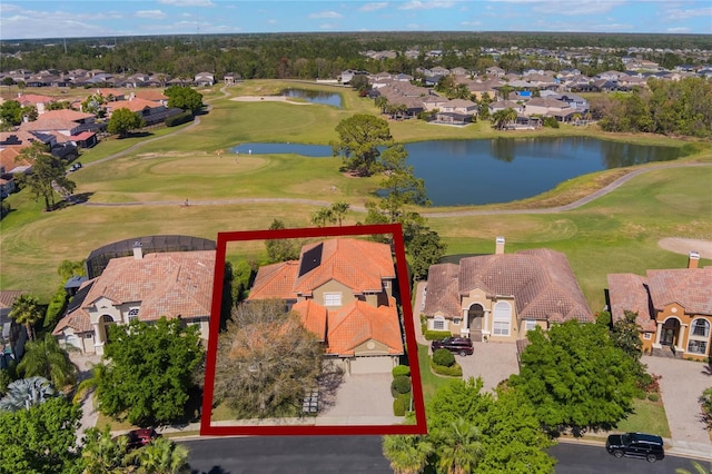 birds eye view of property with a residential view, a water view, and golf course view