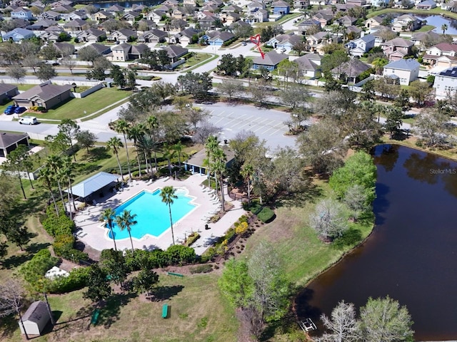 bird's eye view featuring a residential view and a water view