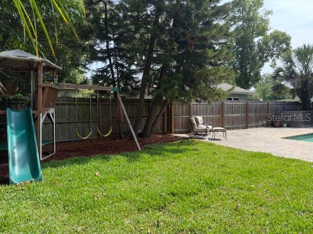 1721 Cheyenne Trl, Maitland, FL 32751 - view of yard with a playground and a patio area