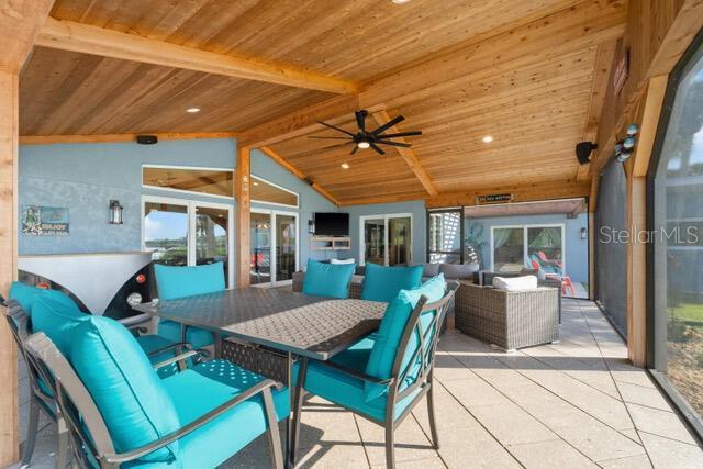 view of patio / terrace with outdoor dining area, ceiling fan, and an outdoor living space