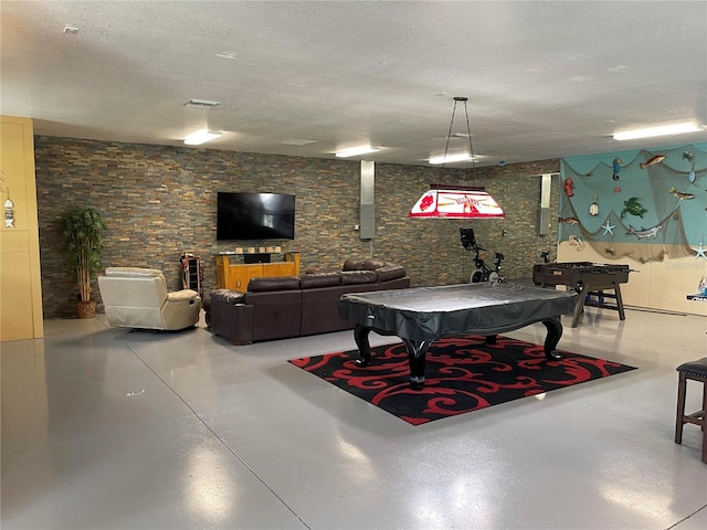 rec room with a textured ceiling, billiards, visible vents, and concrete flooring