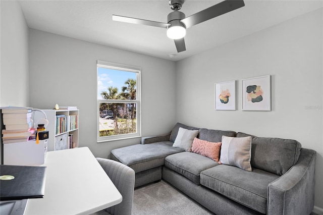 living area featuring ceiling fan