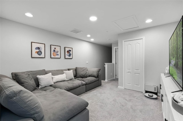 living room featuring attic access, baseboards, visible vents, carpet, and recessed lighting