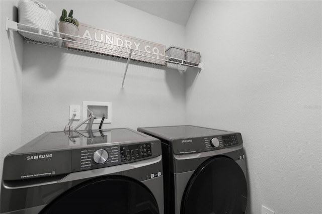 laundry area featuring washer and dryer and laundry area