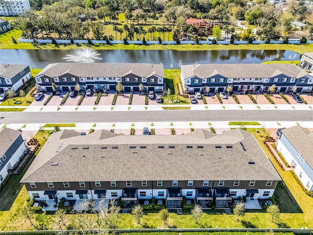 aerial view featuring a residential view and a water view