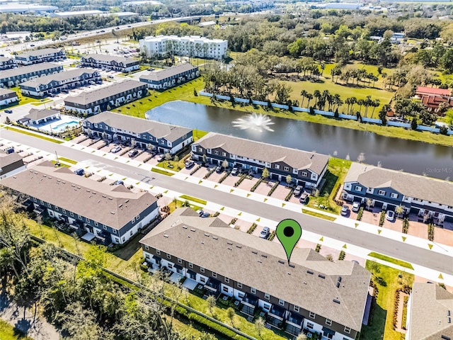 aerial view featuring a water view and a residential view