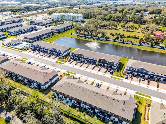 bird's eye view with a residential view and a water view