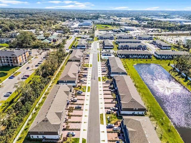 bird's eye view featuring a water view and a residential view