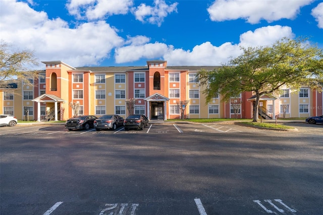 view of property with uncovered parking