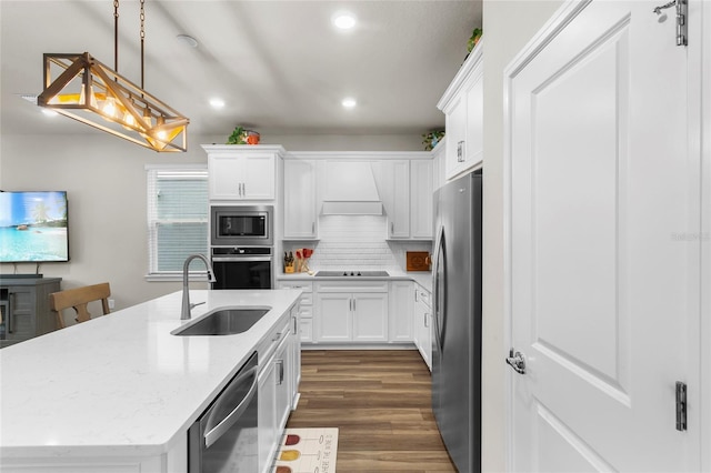 kitchen with stainless steel appliances, premium range hood, a sink, dark wood-style floors, and tasteful backsplash