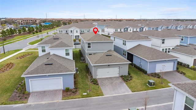 birds eye view of property with a residential view