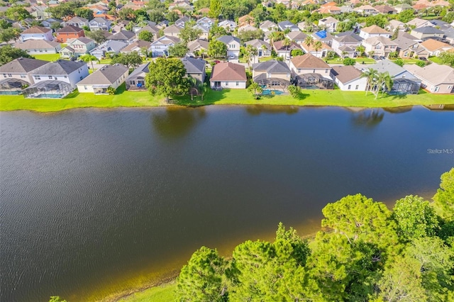 aerial view with a water view and a residential view