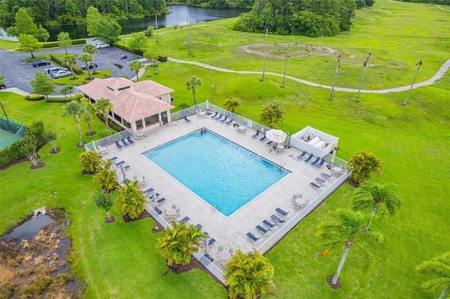 birds eye view of property with a water view